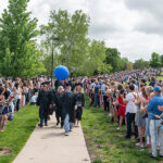 At long last, ’70 and ’72 grads walk down the Hill